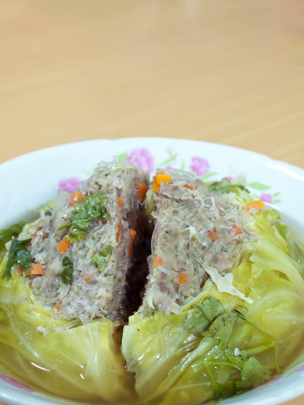 Minced pork mixed with flavouring stuffed in cabbage in soup in bowl, traditional Thai style food.