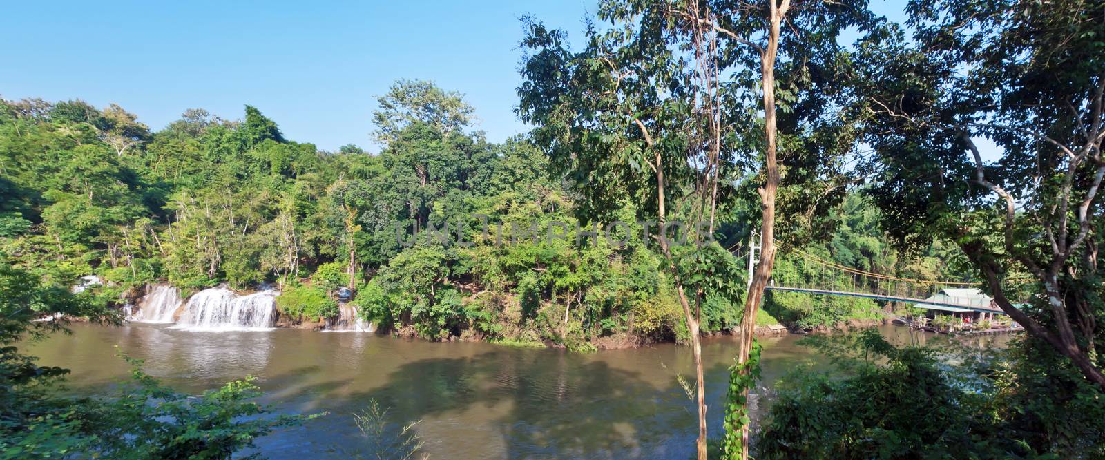 Panorama Sai Yok Yai waterfall flow into Khwae Noi river with Suspension bridge, Sai Yok National Park, Kanchanaburi, Thailand