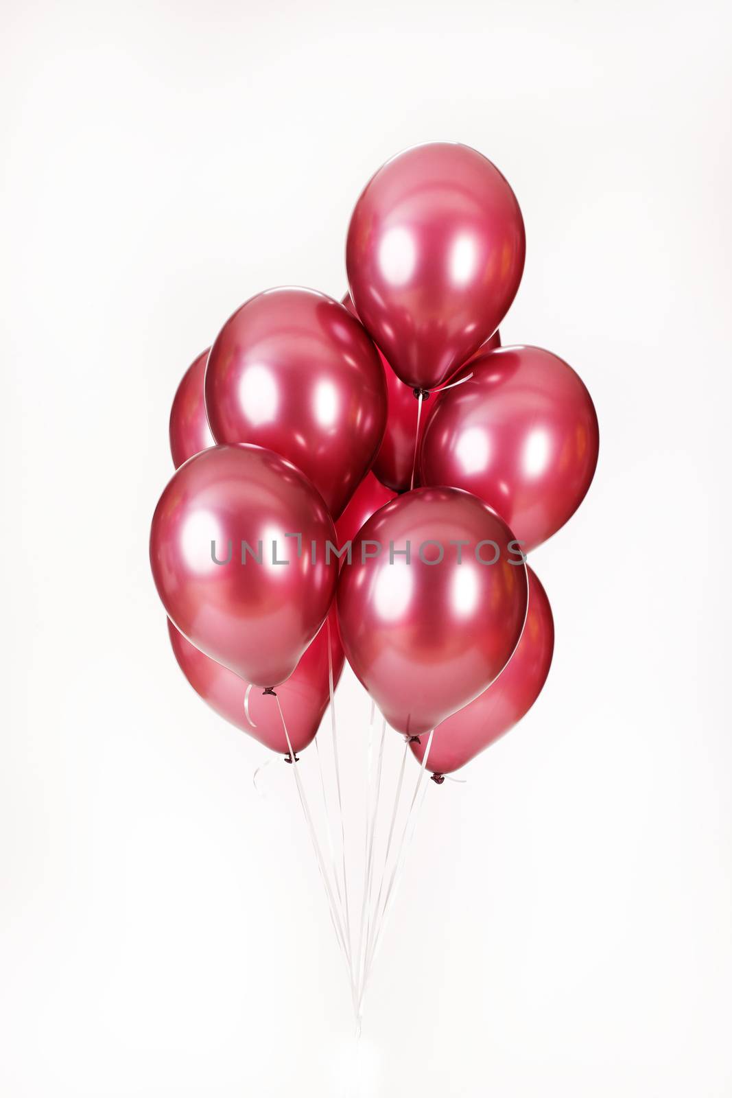 Multicoloured air balloons on isolated studio background