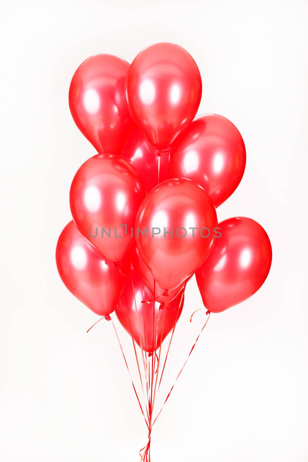 Multicoloured air balloons on isolated studio background