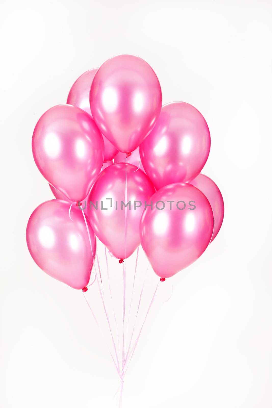 Multicoloured air balloons on isolated studio background