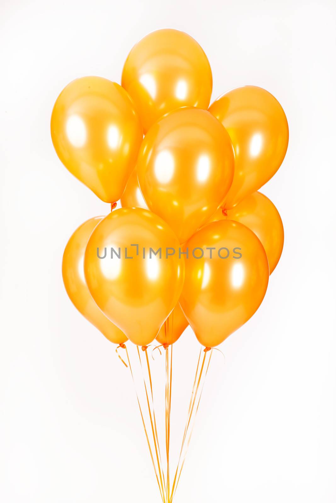 Multicoloured air balloons on isolated studio background