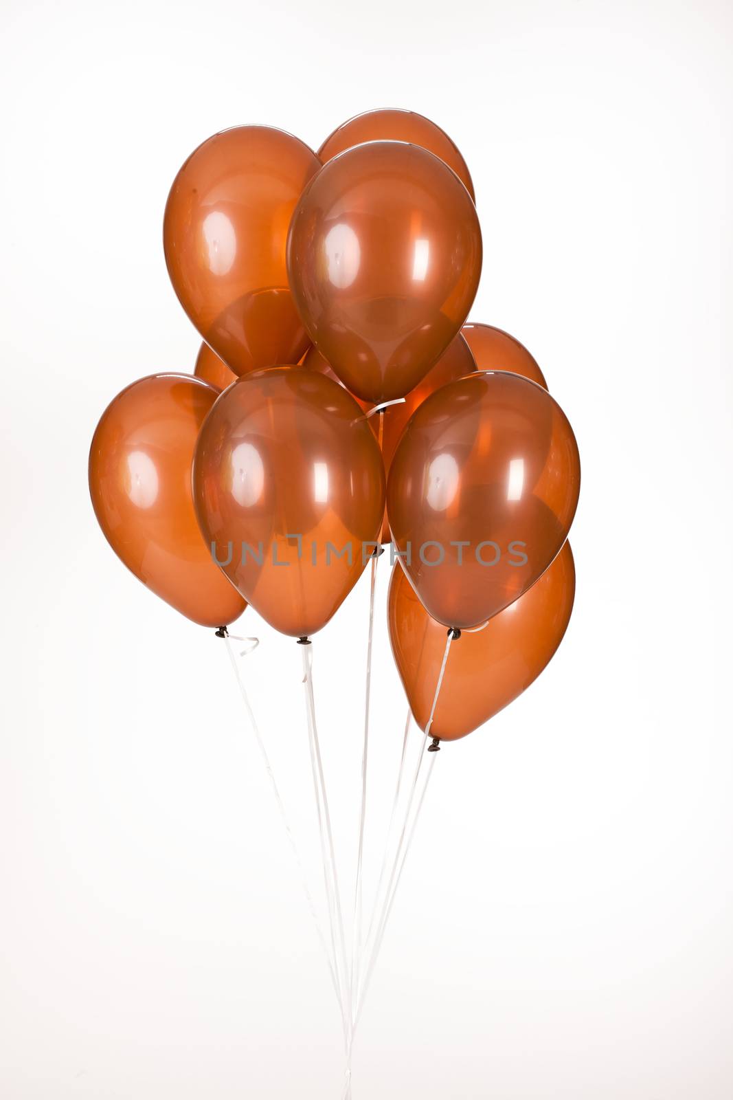 Multicoloured air balloons on isolated studio background