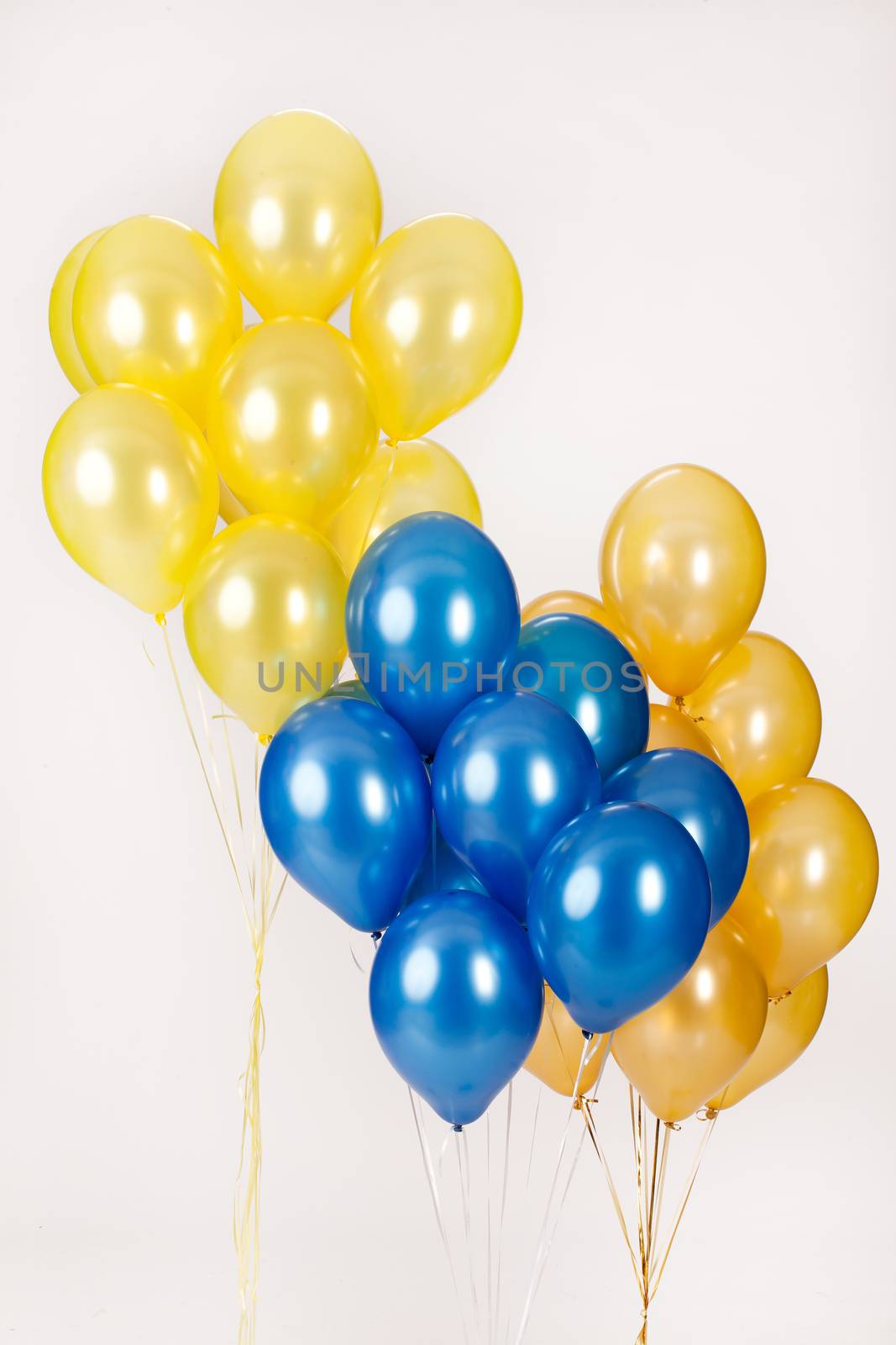 Multicoloured air balloons on isolated studio background