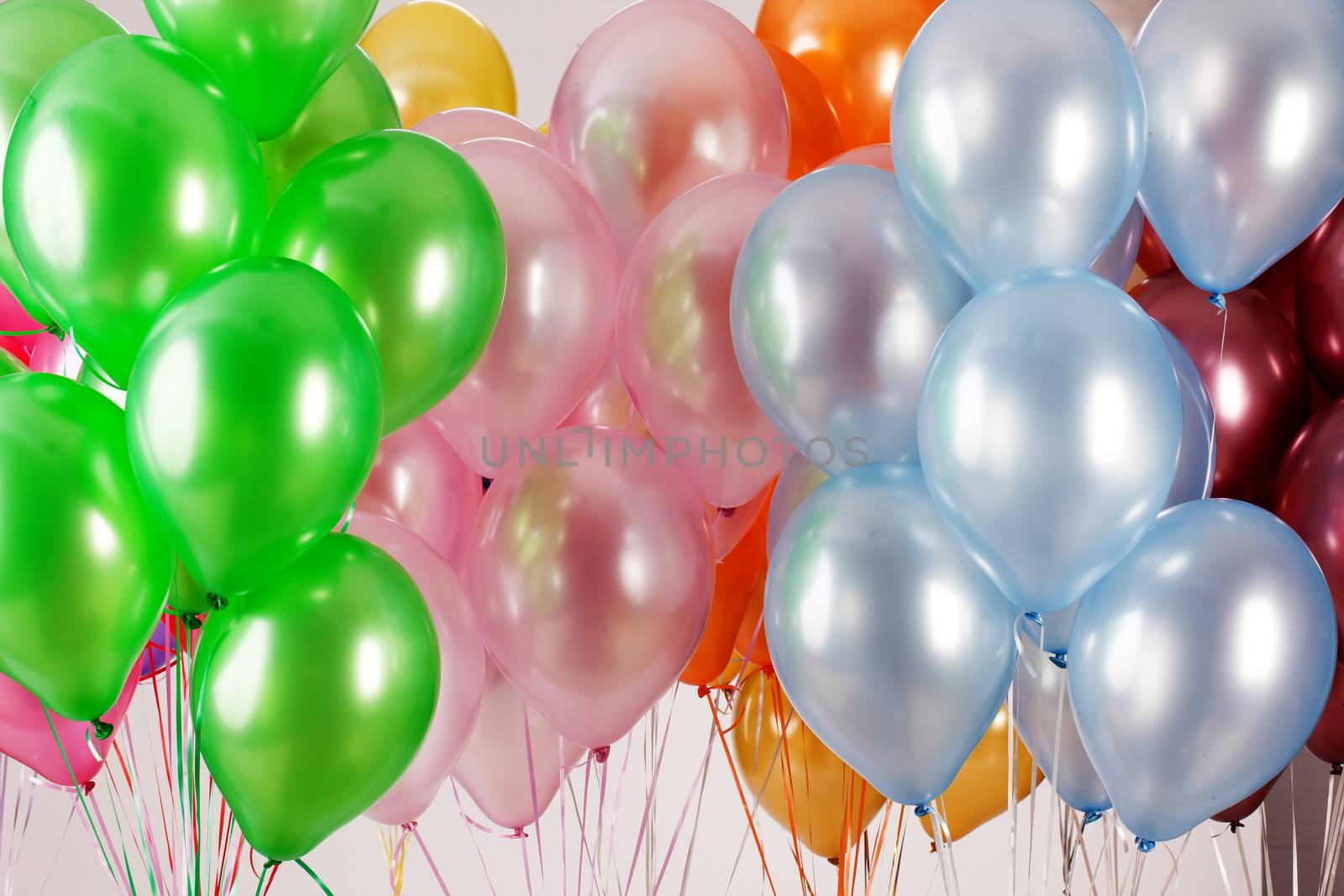 Multicoloured air balloons on isolated studio background