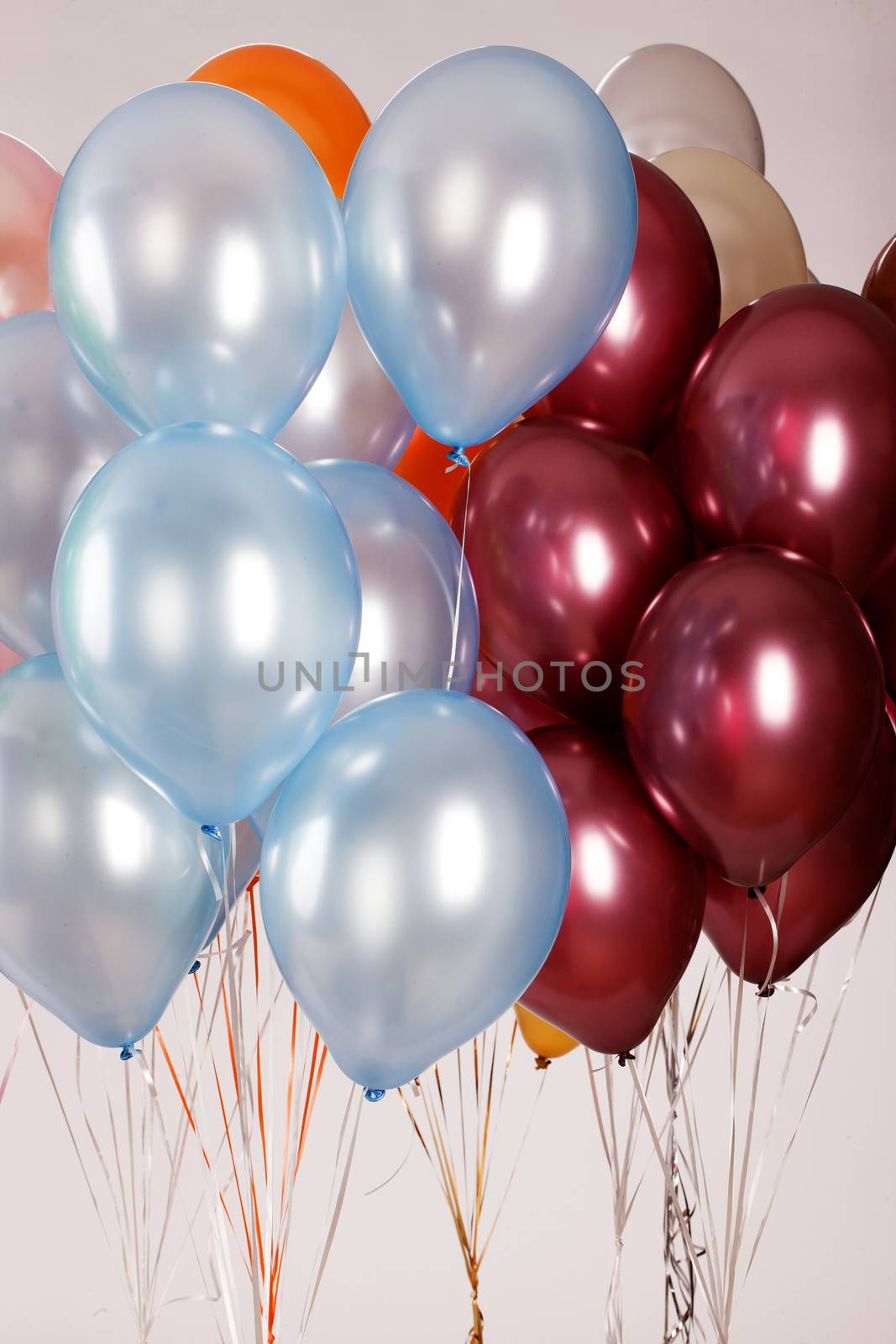 Multicoloured air balloons on isolated studio background