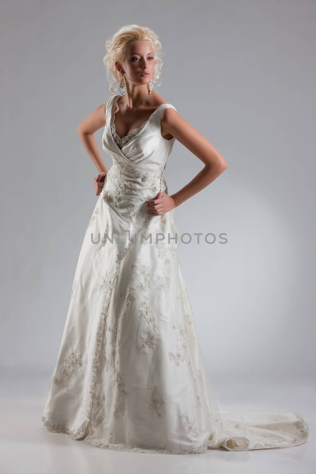 Young beautiful blonde woman in a fashionable wedding dress