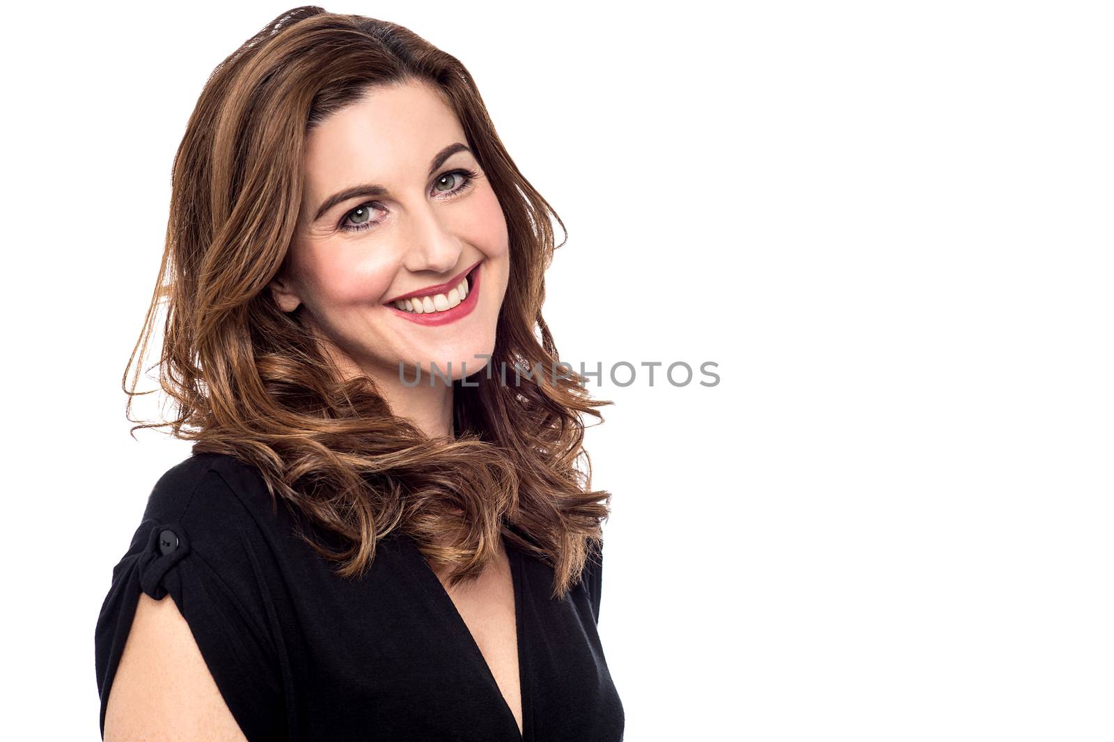 Cheerful woman posing to camera by stockyimages