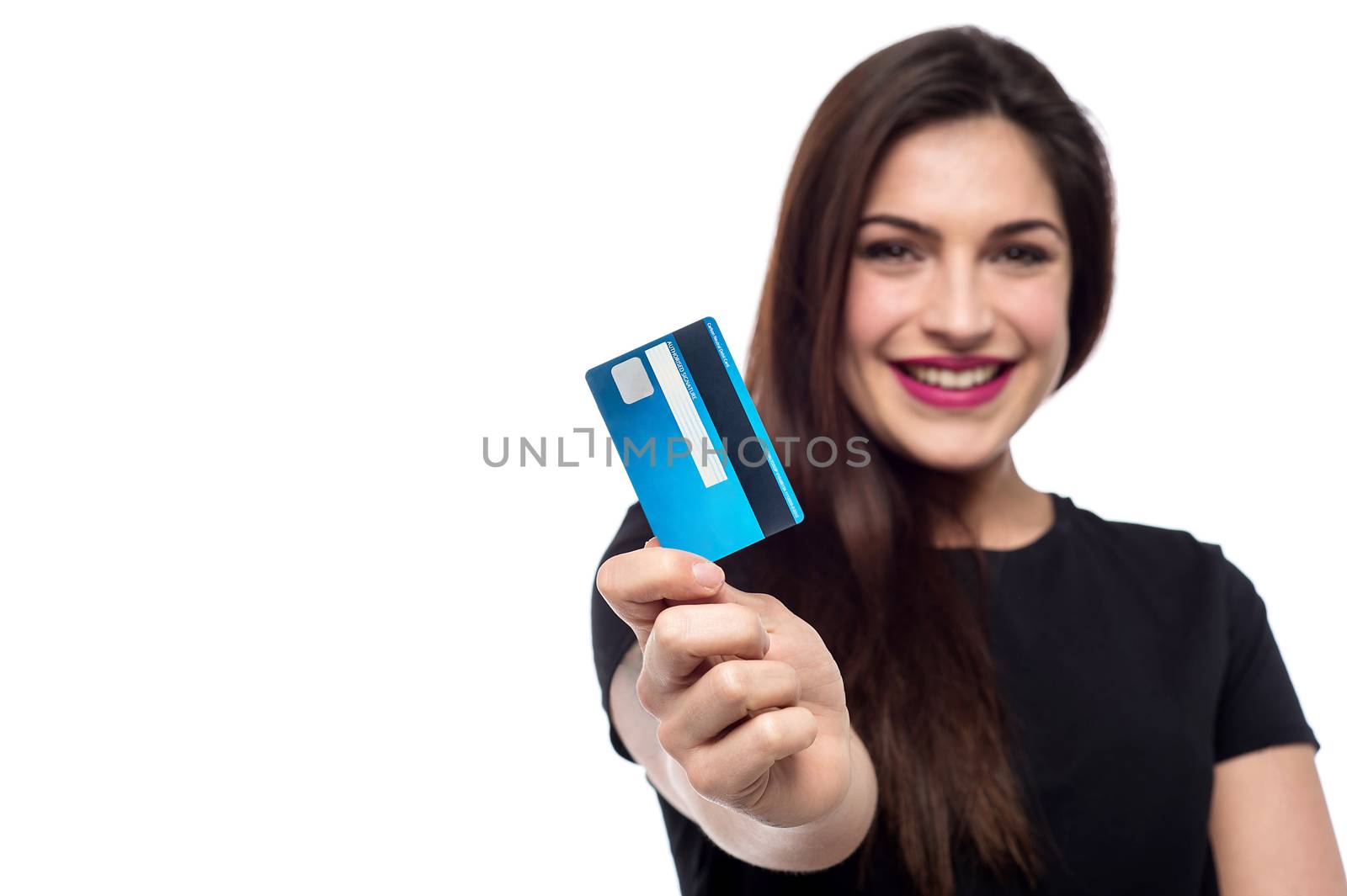 Cheerful woman showing her credit card to camera