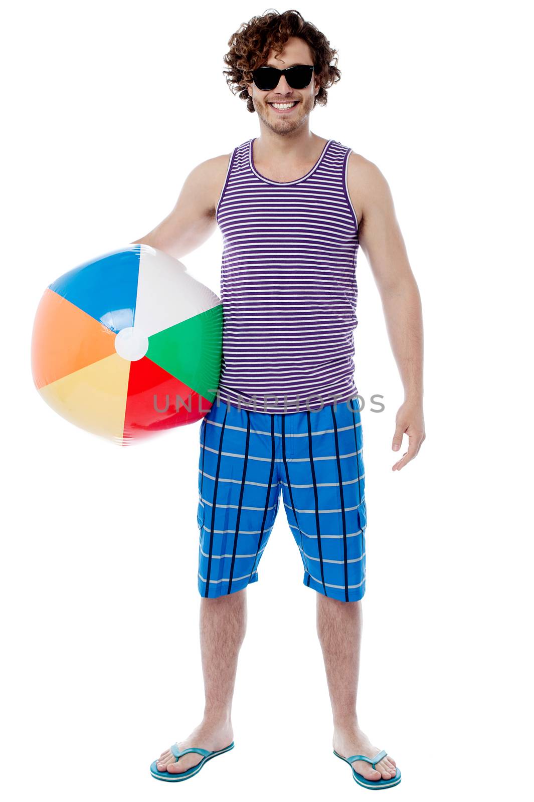 Handsome young guy posing with beach ball