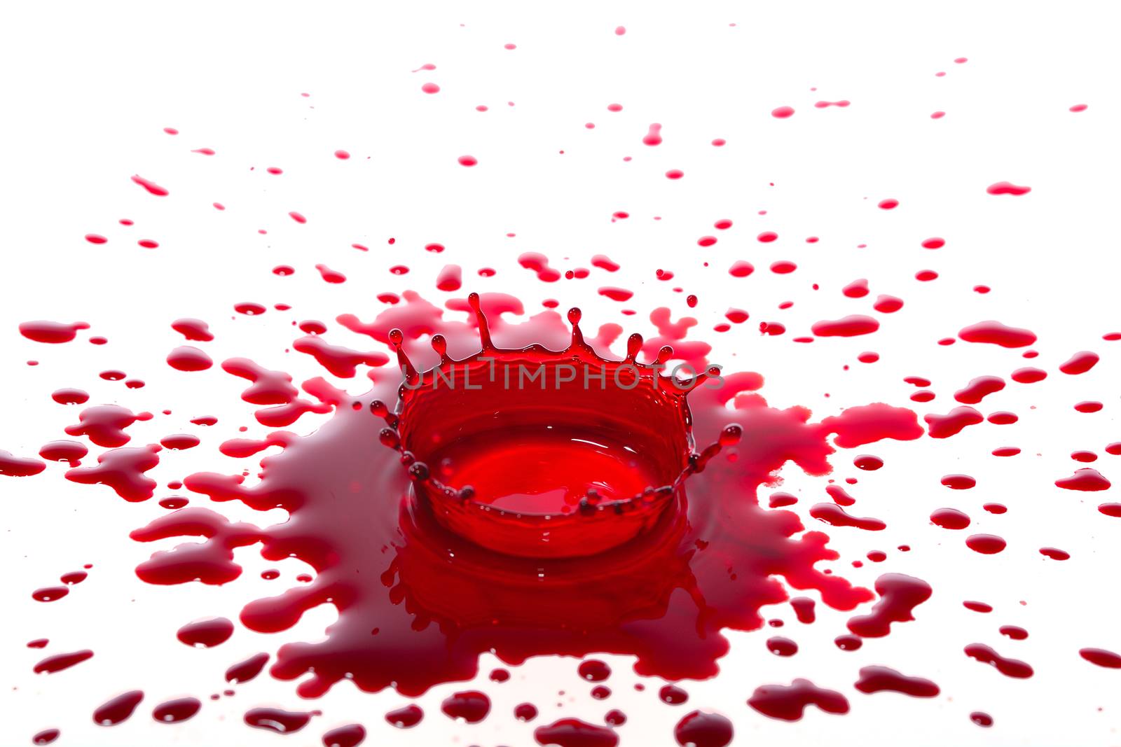 Colorful red splashing isolated on white background