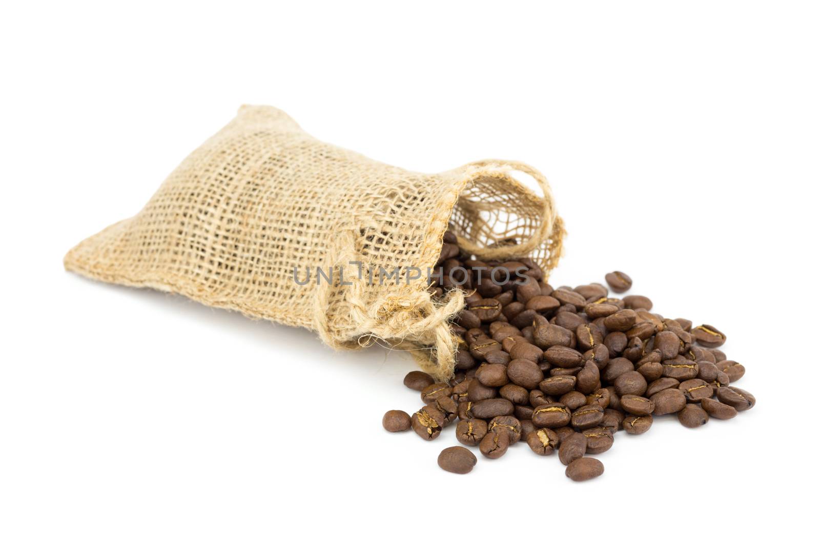 Little sackcloth with loose coffee beans isolated on white background