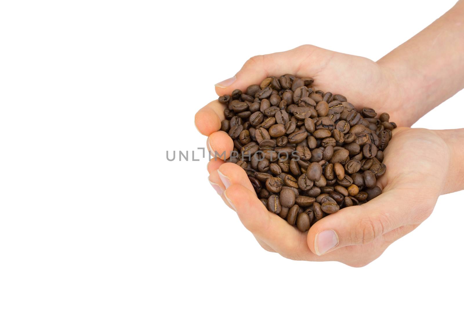 Two hands holding many coffee beans isolated on white background