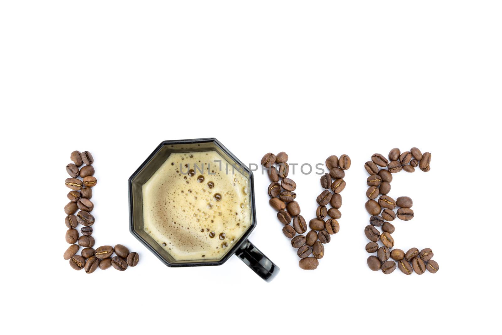 Word LOVE with coffee beans and black cup isolated on white background