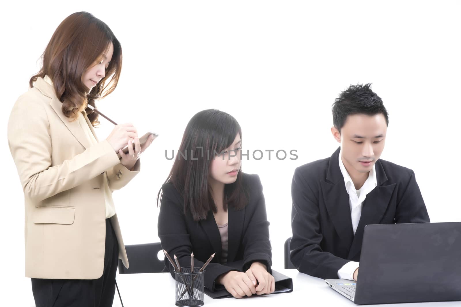 Three asian business in office, discussing document on computer