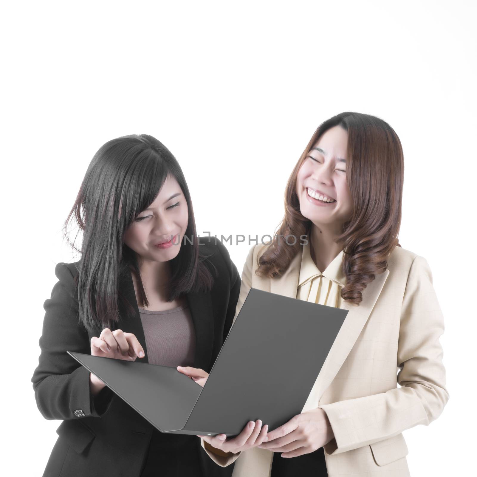 Two asian business woman in office, discussing profile