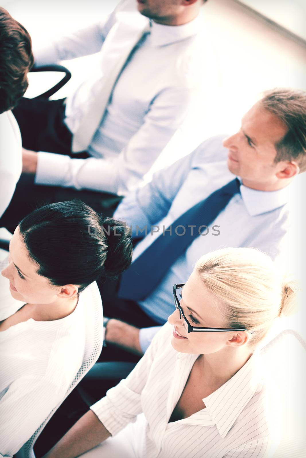 businessmen and businesswomen on conference by dolgachov