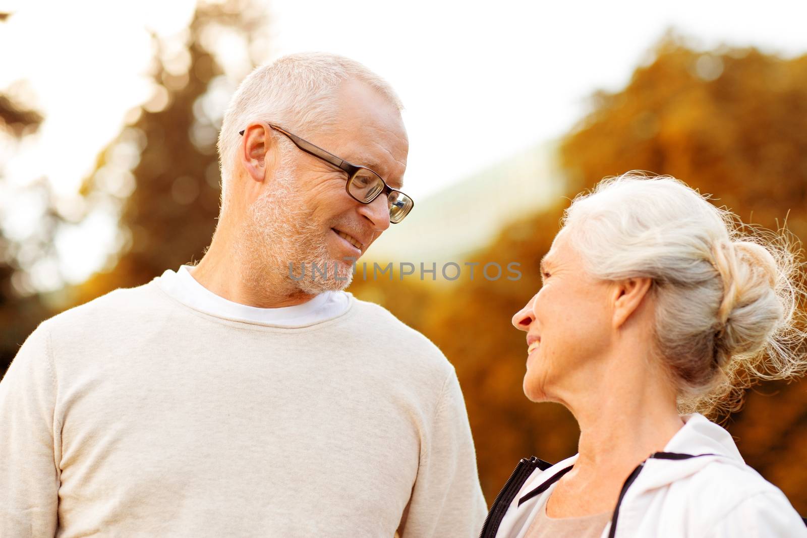 senior couple in city park by dolgachov