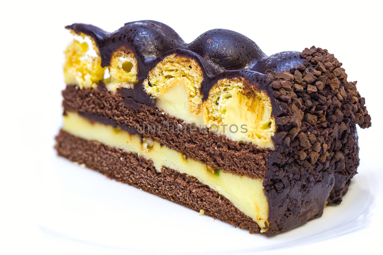 a piece of isolated vanilla and chocolate cake