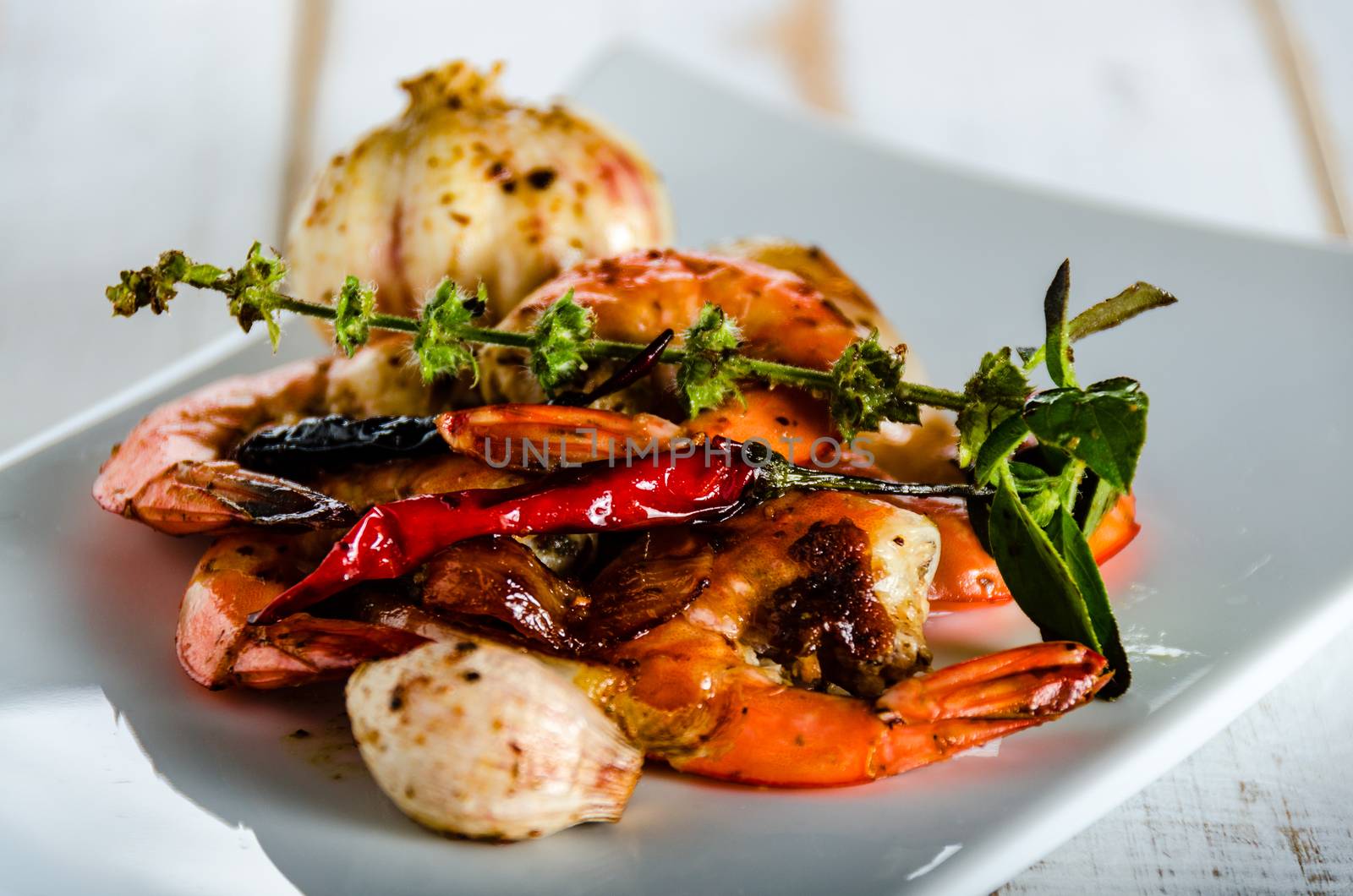 Shrimps on white plate by p.studio66