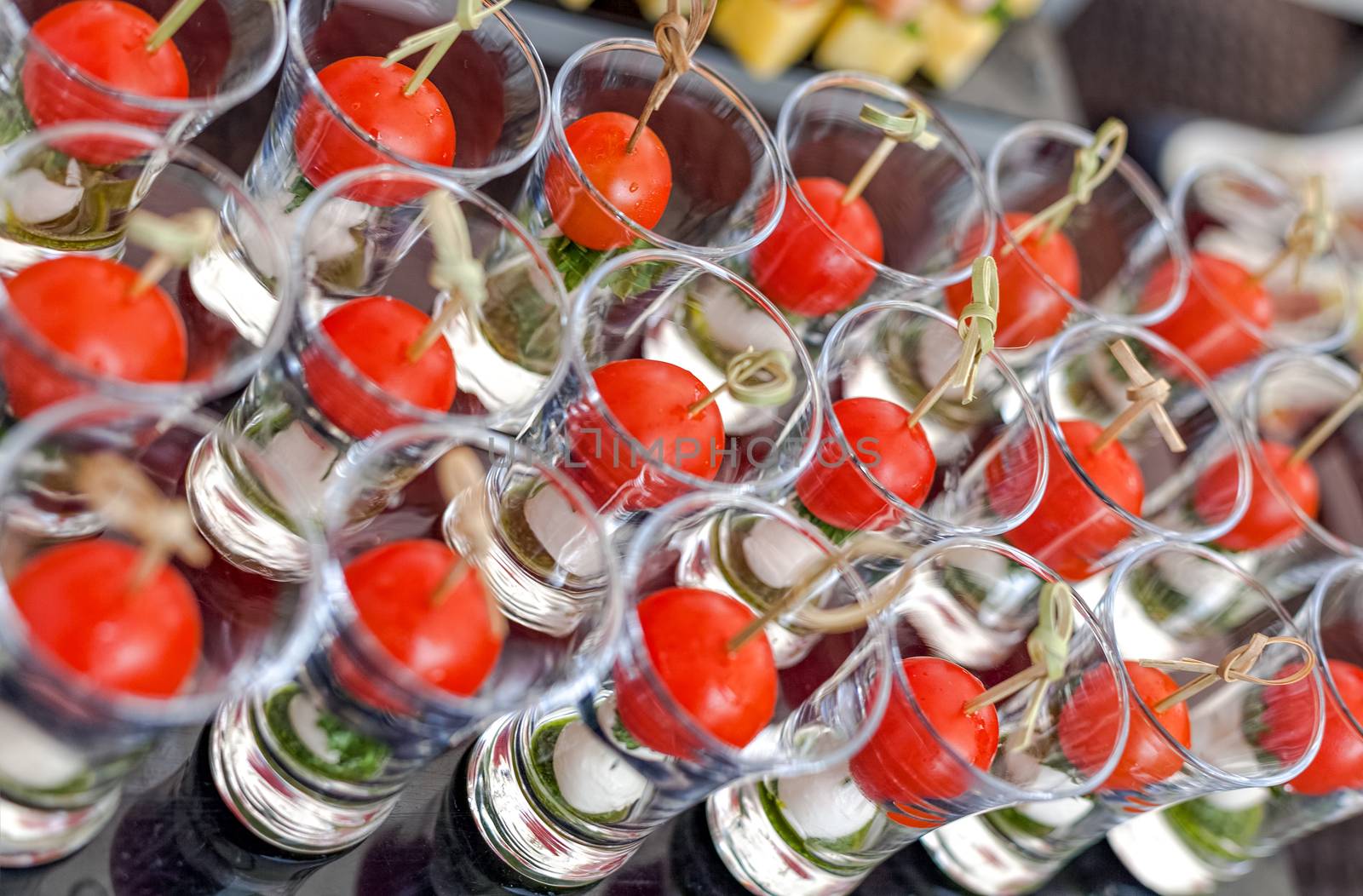 Cheese canapes with cherry tomatoes in the glass by vladimir_sklyarov