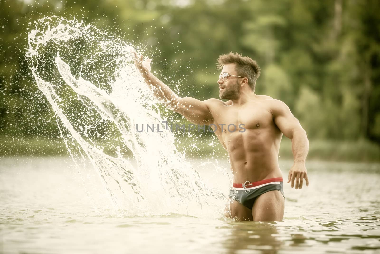 muscular man lake by magann