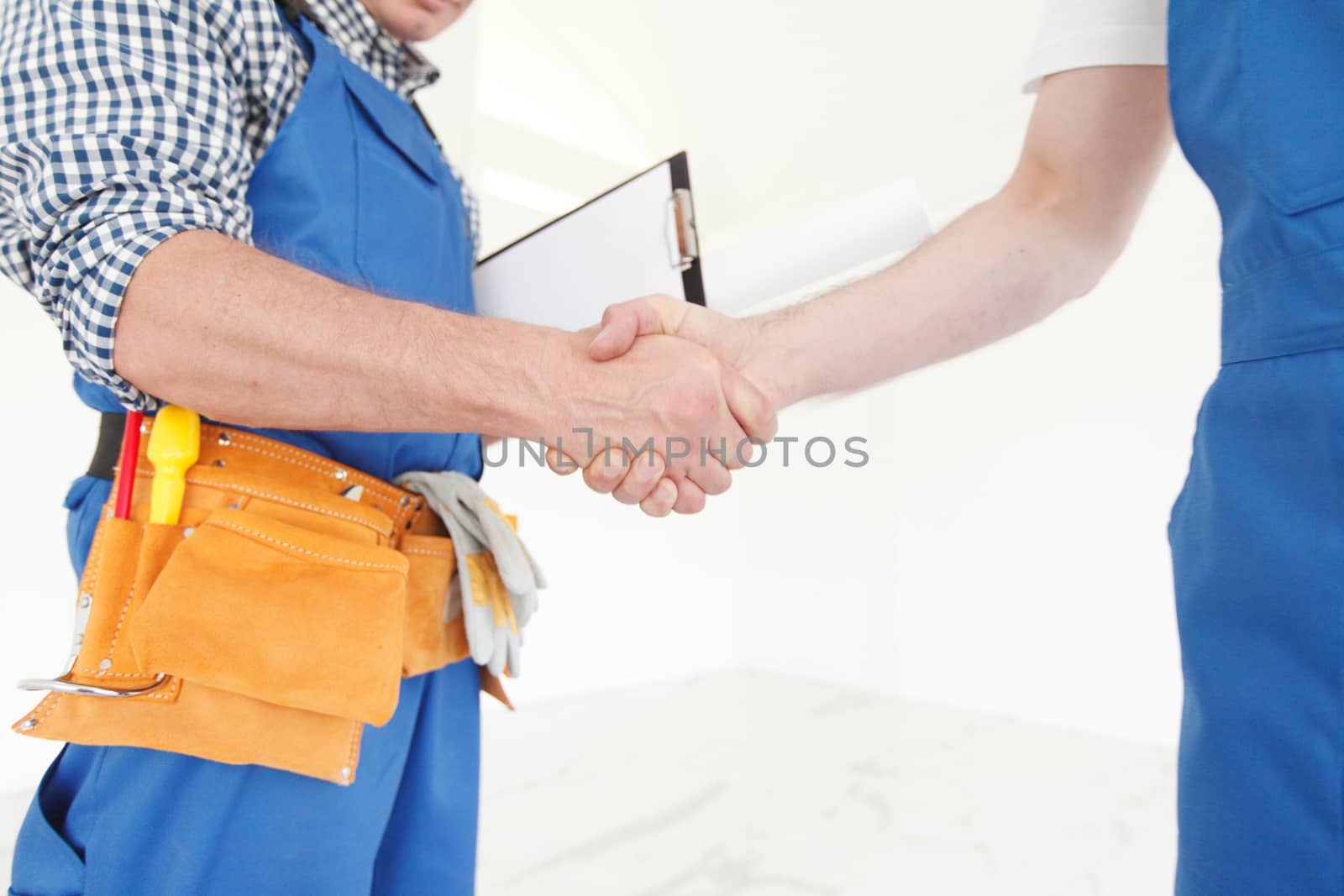 workmen handshake by ALotOfPeople