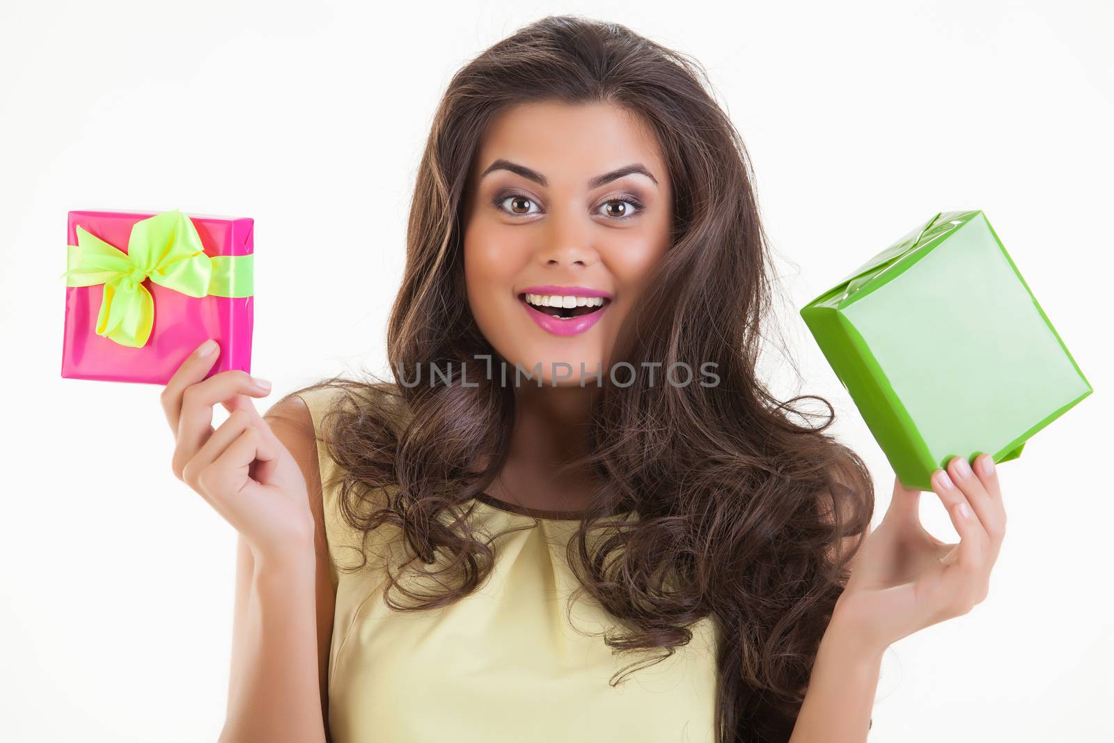 Young beautiful woman with box on isolated studio bakground