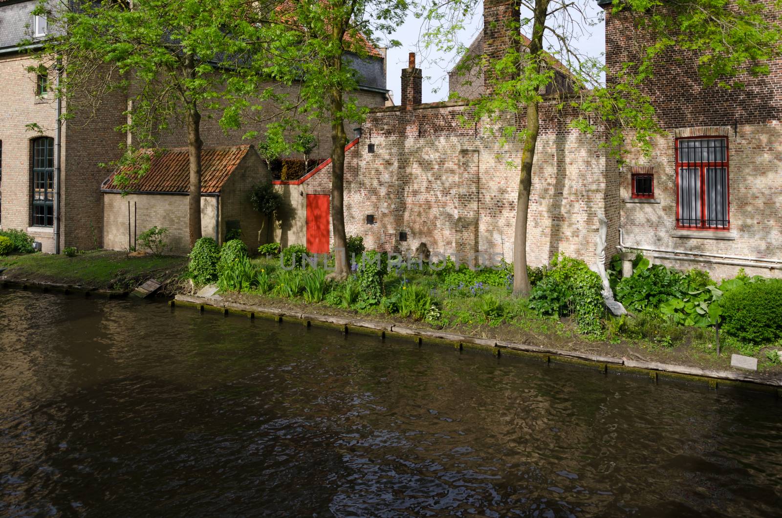 Canal in Bruges, begijnhof by siraanamwong