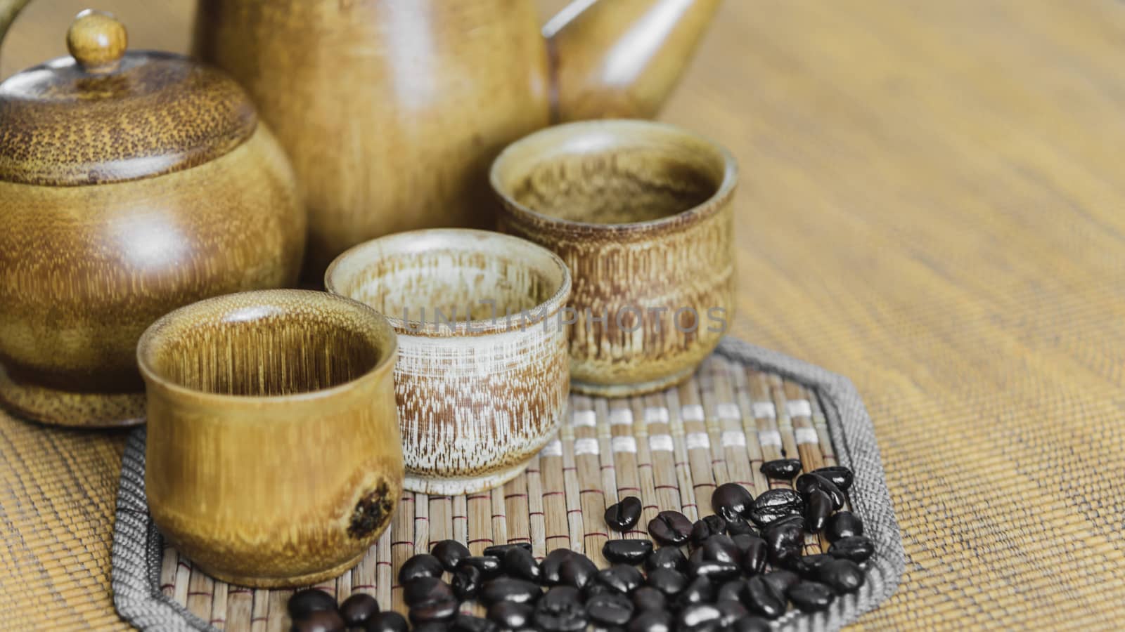 Soft focus image of coffee beans and coffee cups set on wooden background.Vintage style.(soft focus)