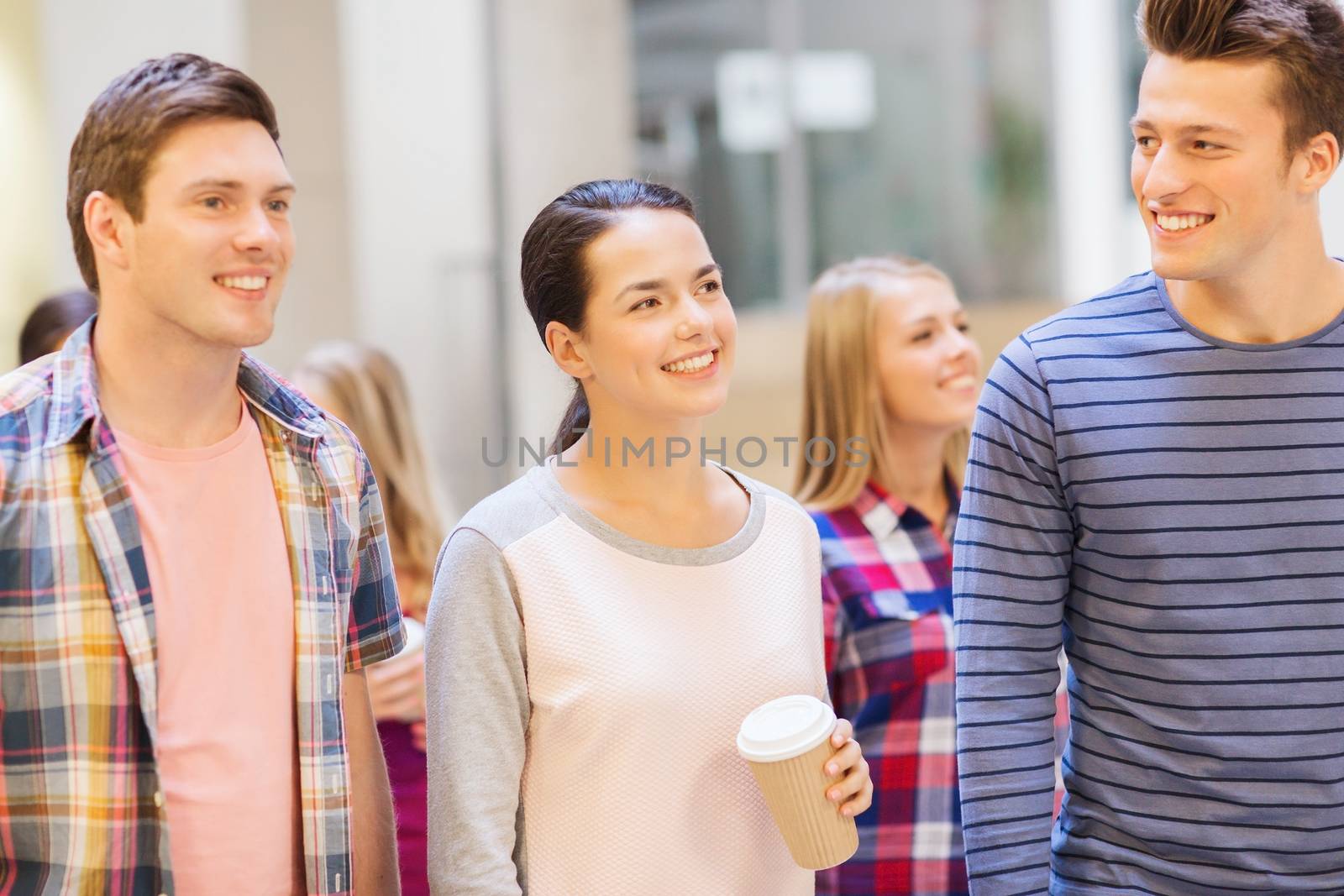 education, high school, friendship, drinks and people concept - group of smiling students with paper coffee cups