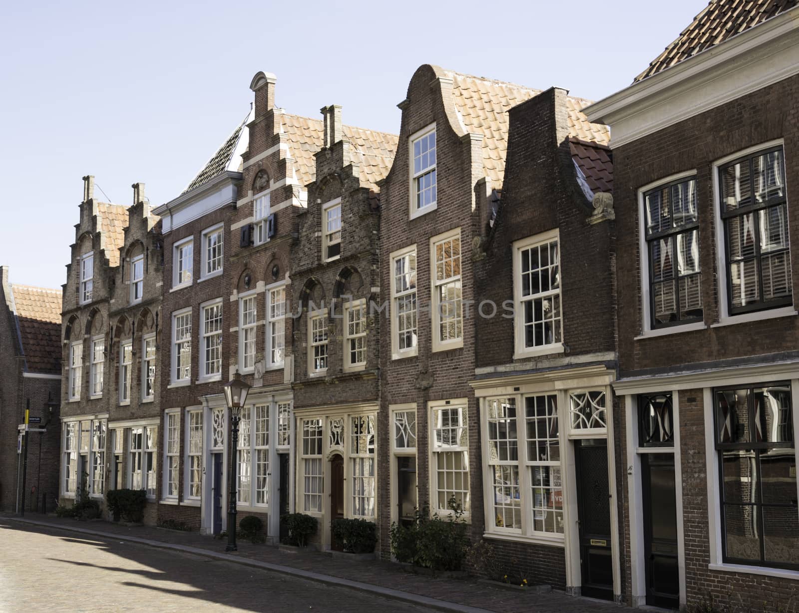 DORDRECHT,NETHERLANDS-FEBRUARY 2 2015. old houses with typivcal dutch village gables like stapped and neck gable in Dordrecht on February 02 2015,this village is already knwo from1200