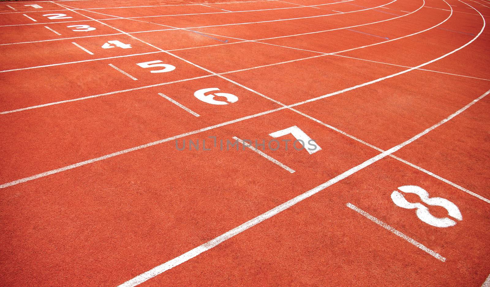 Red treadmill at the stadium with the numbering from one to eight