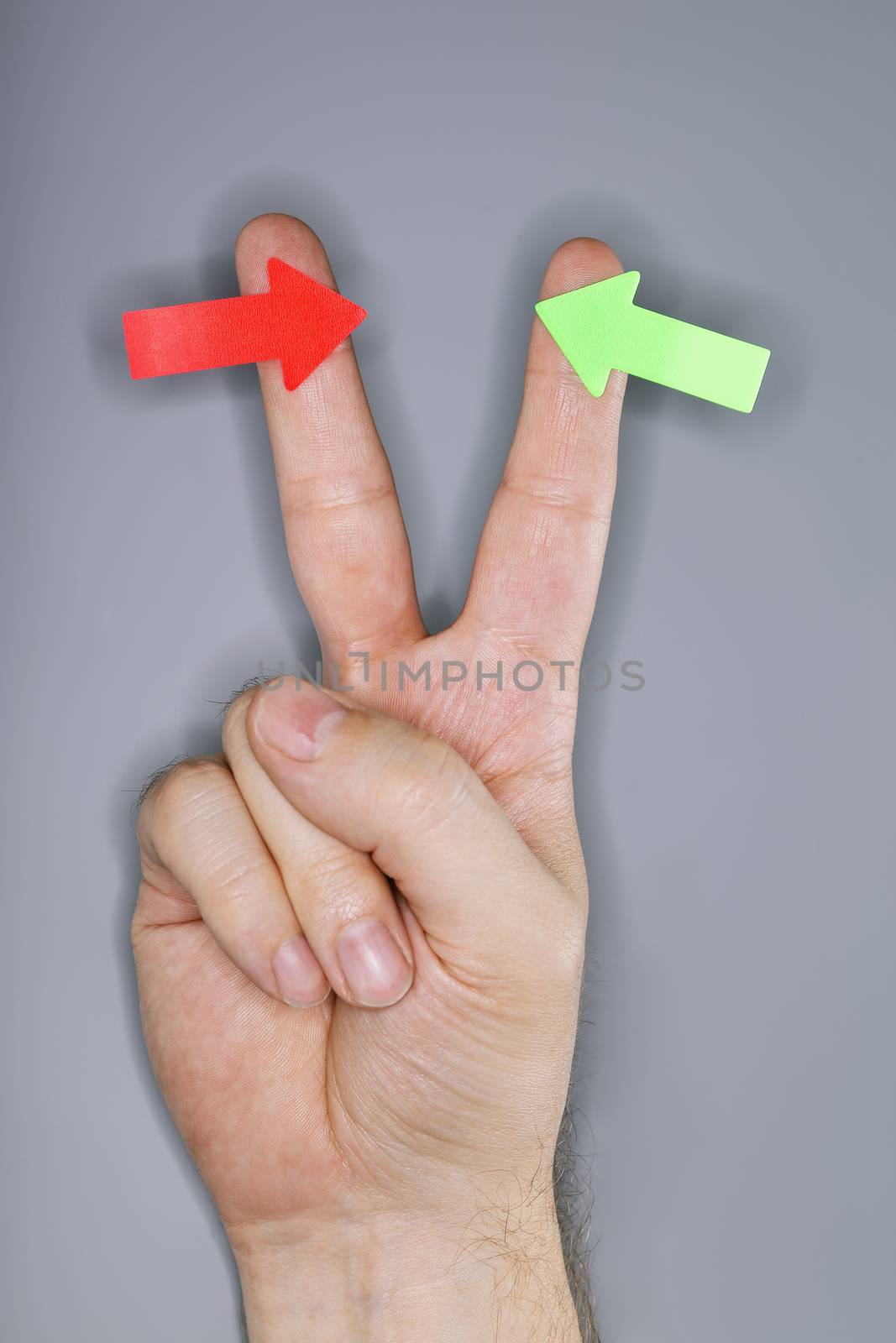 A hand with arrow stickers. Very short depth-of-field and ring flash lighting.