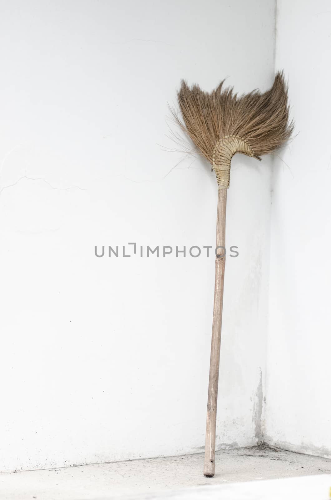 Broom beside wall by pixbox77