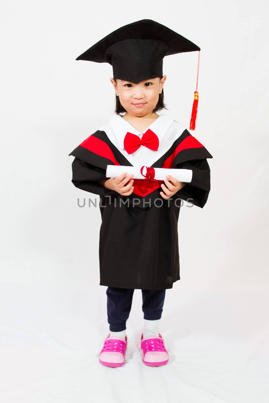 Chinese little girl graduation in white backround studio shot.