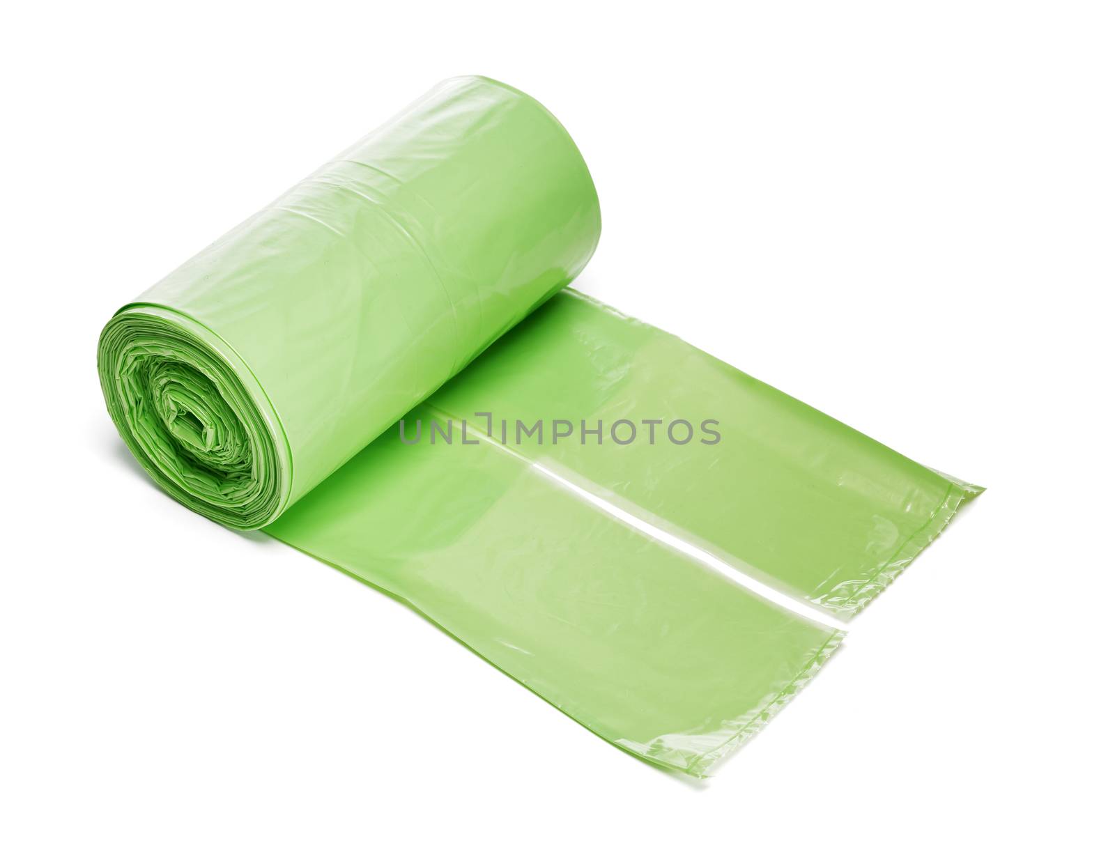 Roll of green plastic trashbags isolated on white with naturan shadow.