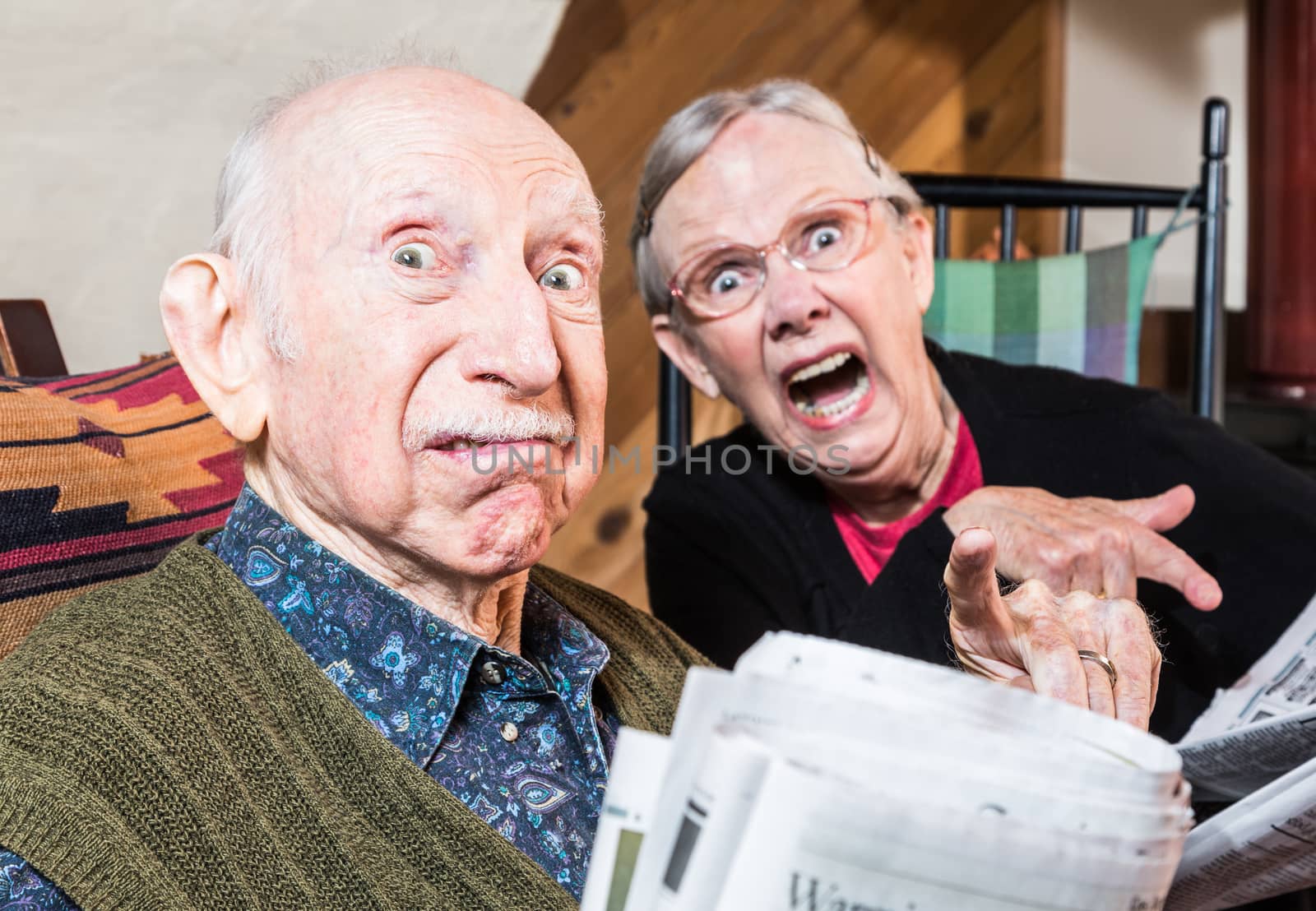 Old Mad Couple with Newspaper by Creatista