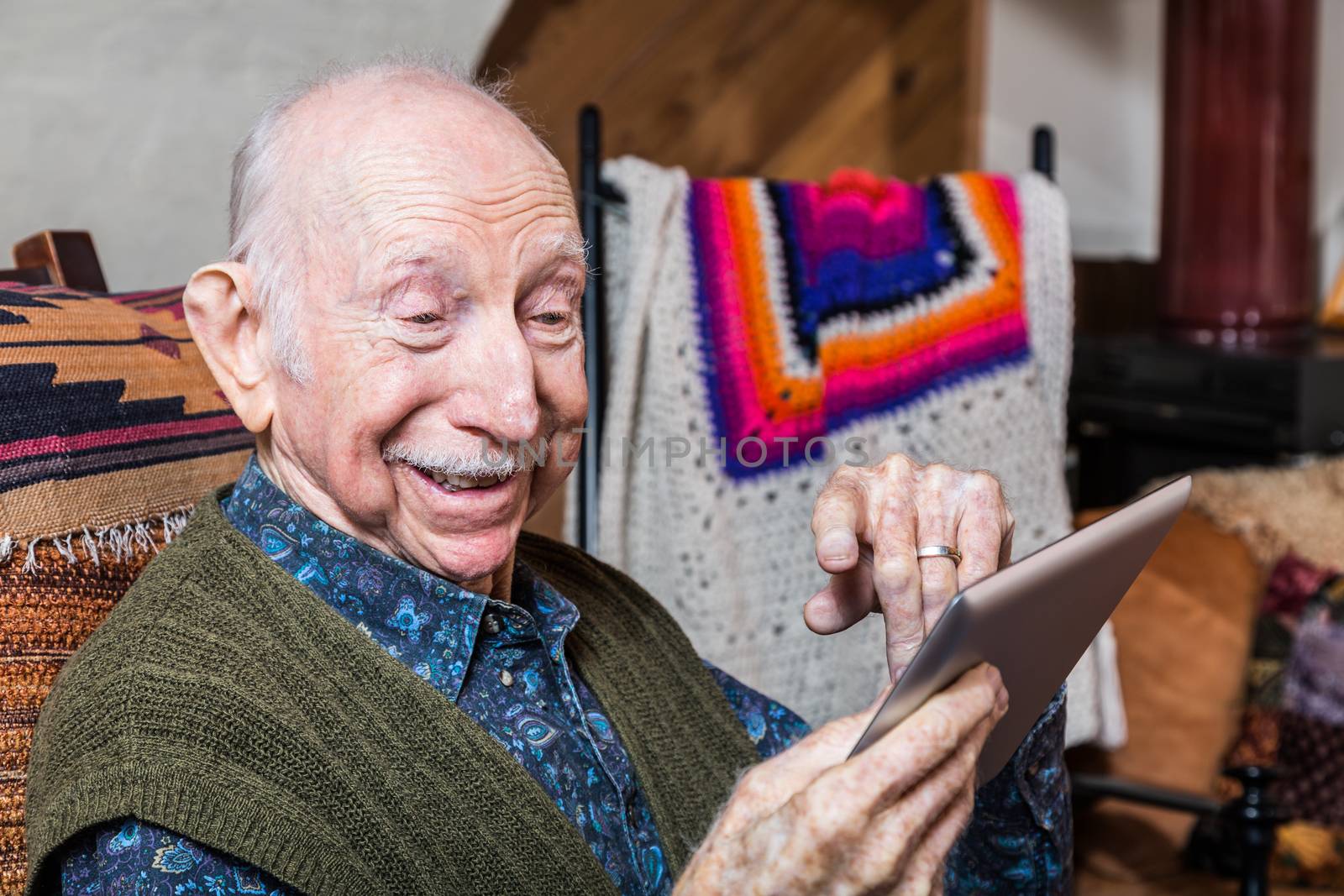 Smiling Older Gentleman with Tablet by Creatista