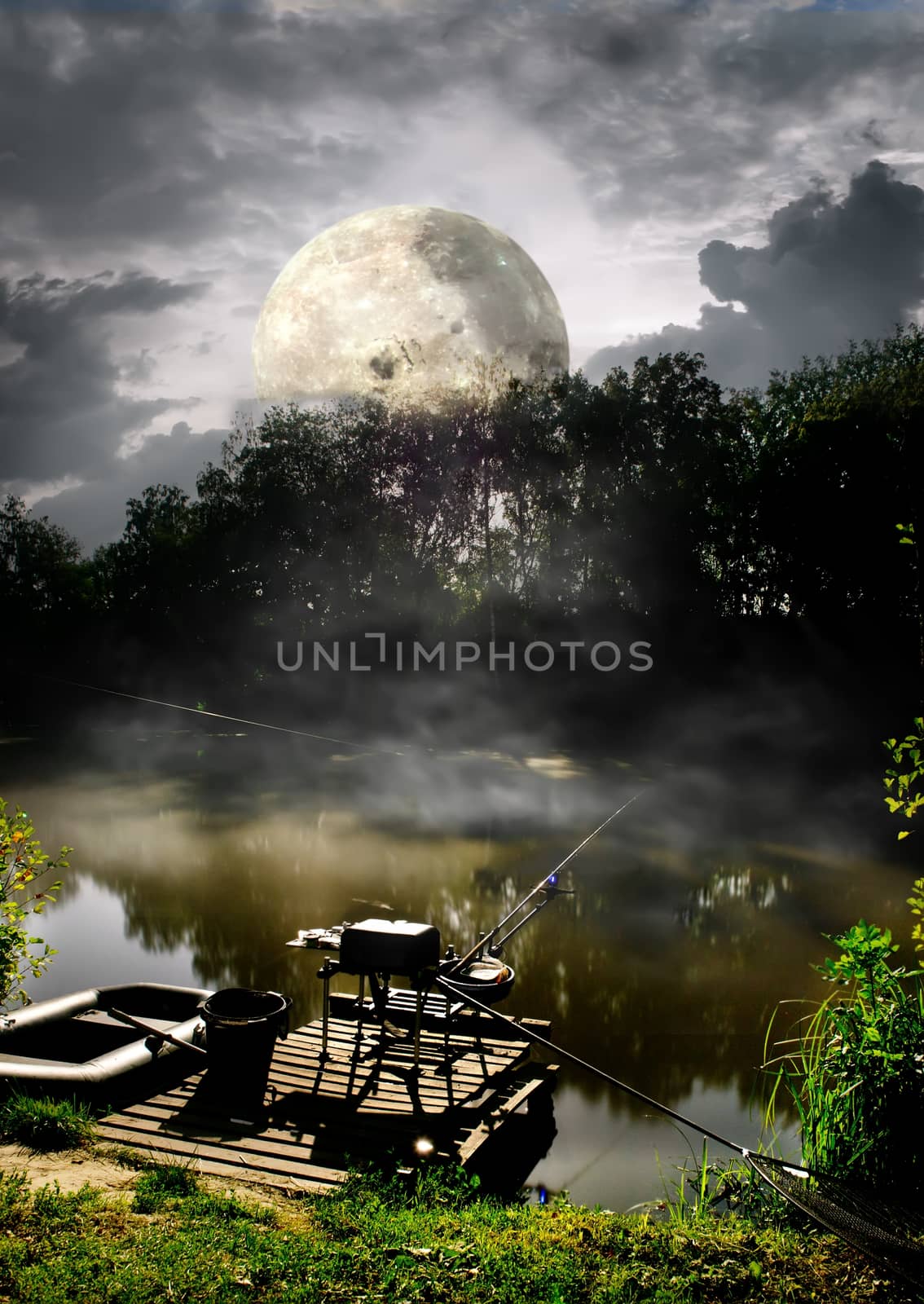 Full moon over fishing pier on river