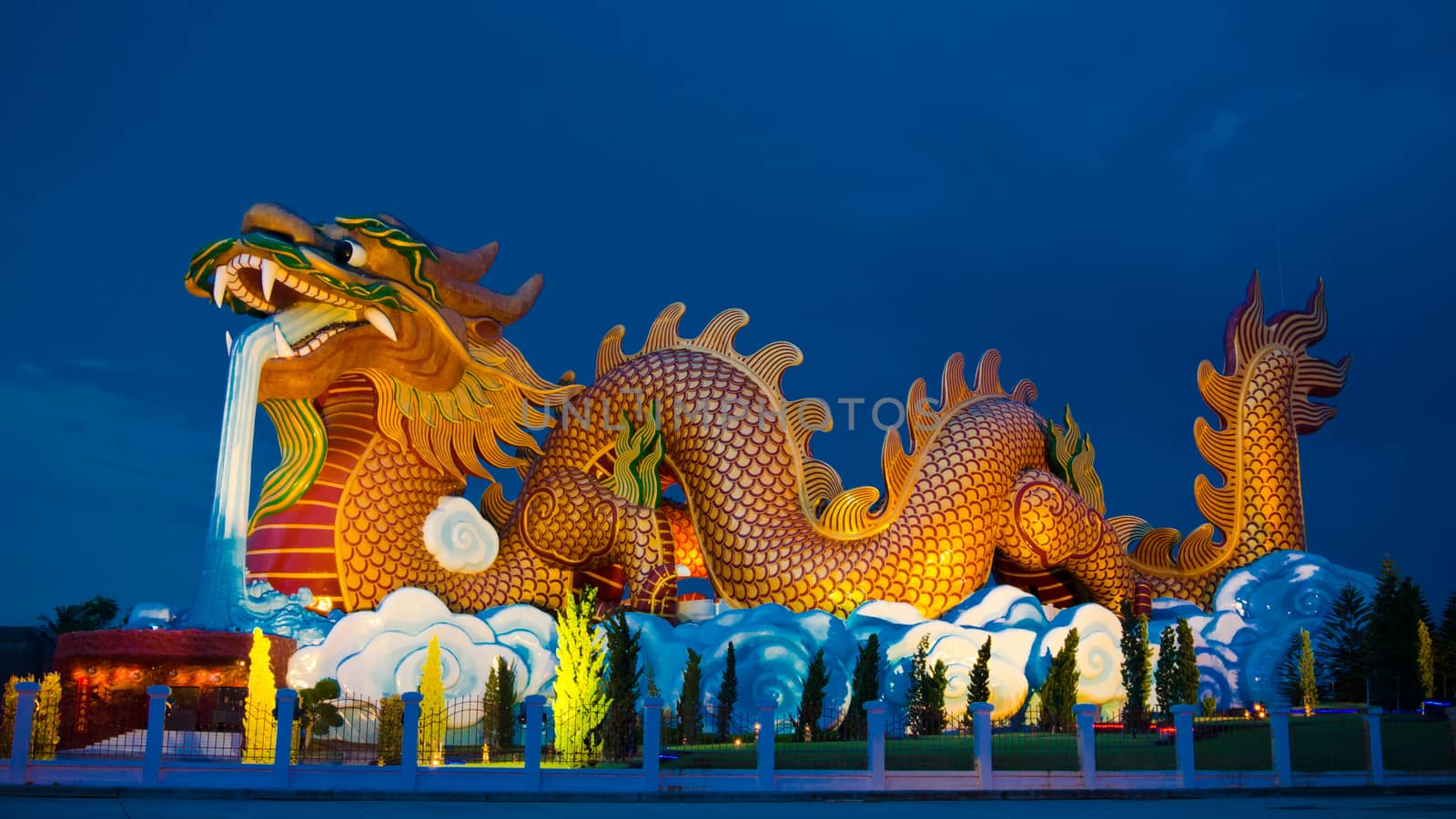 Big dragon statue at night, Supanburi Thailand by pixbox77