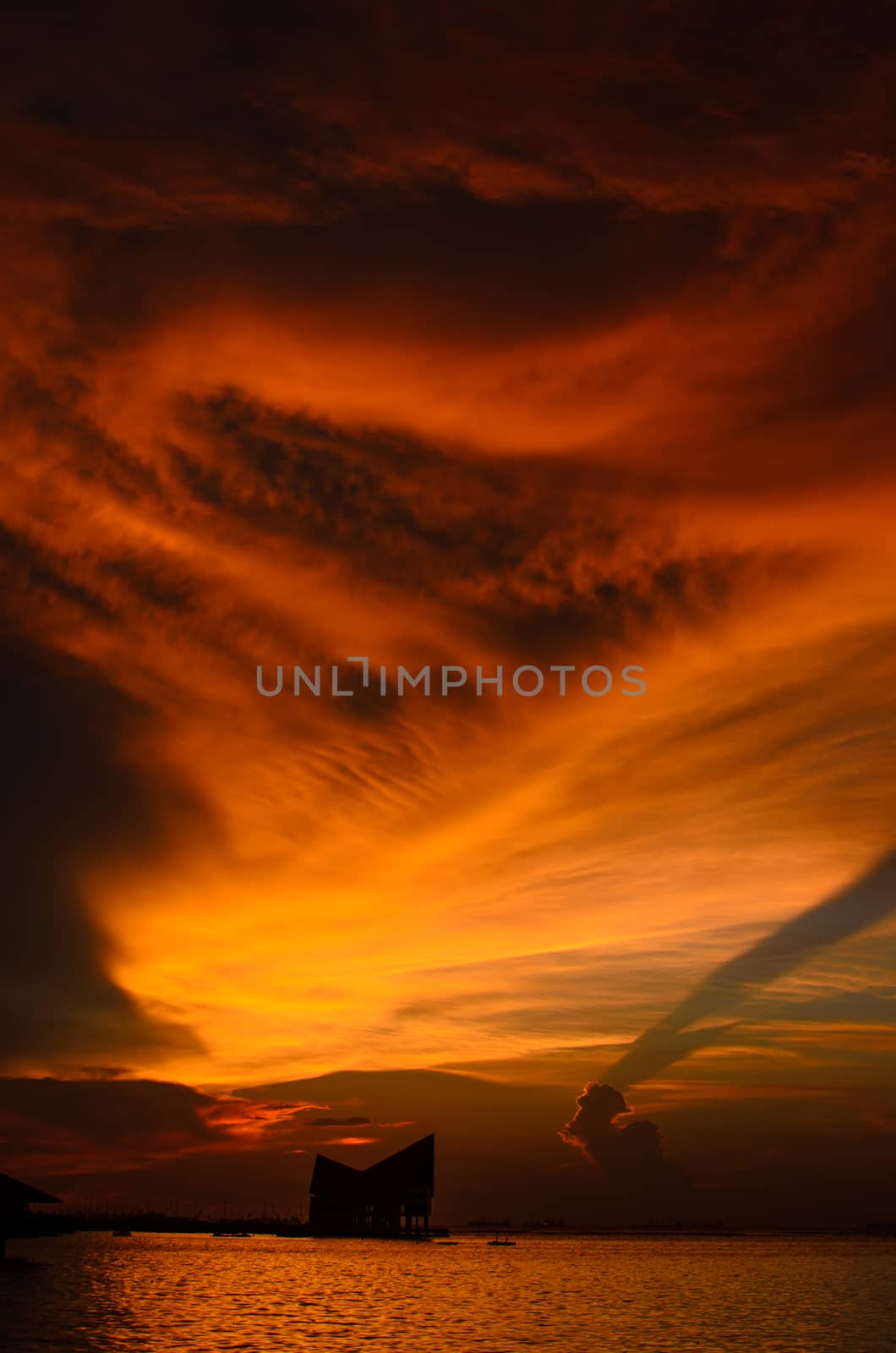 Dramatic sunset sky at sea by pixbox77