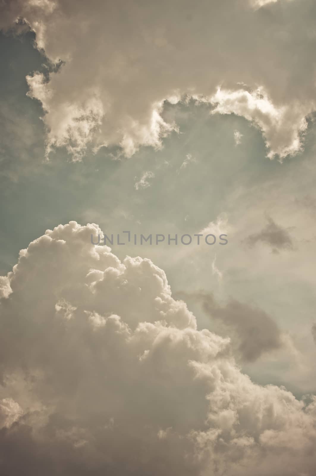 Nice clouds in blue sky in vintage style by pixbox77