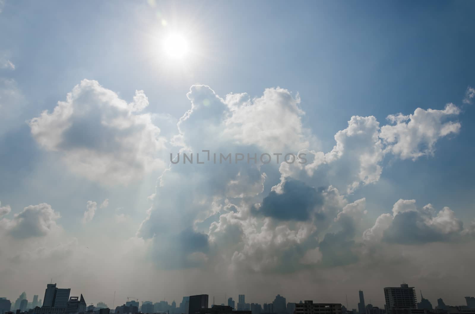 Sun and cloud in blue sky over Bangkok city by pixbox77