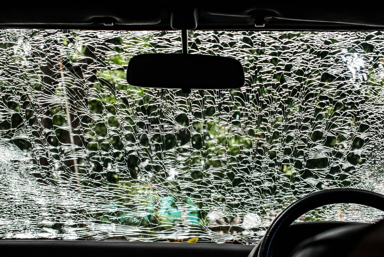 Damaged glass (car windshield) inside car by pixbox77