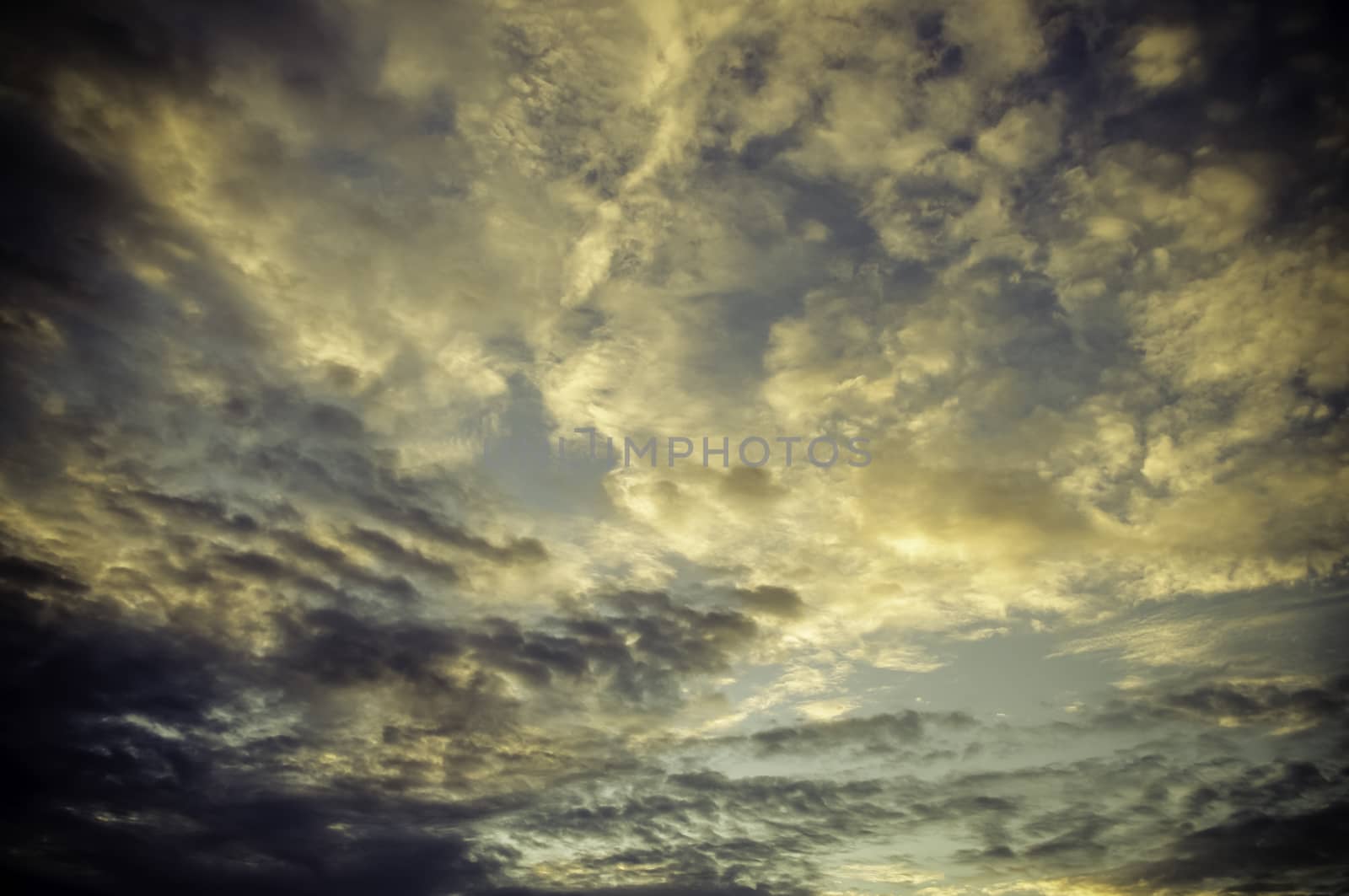 Nice cloudy sky with sunset light in vintage color style