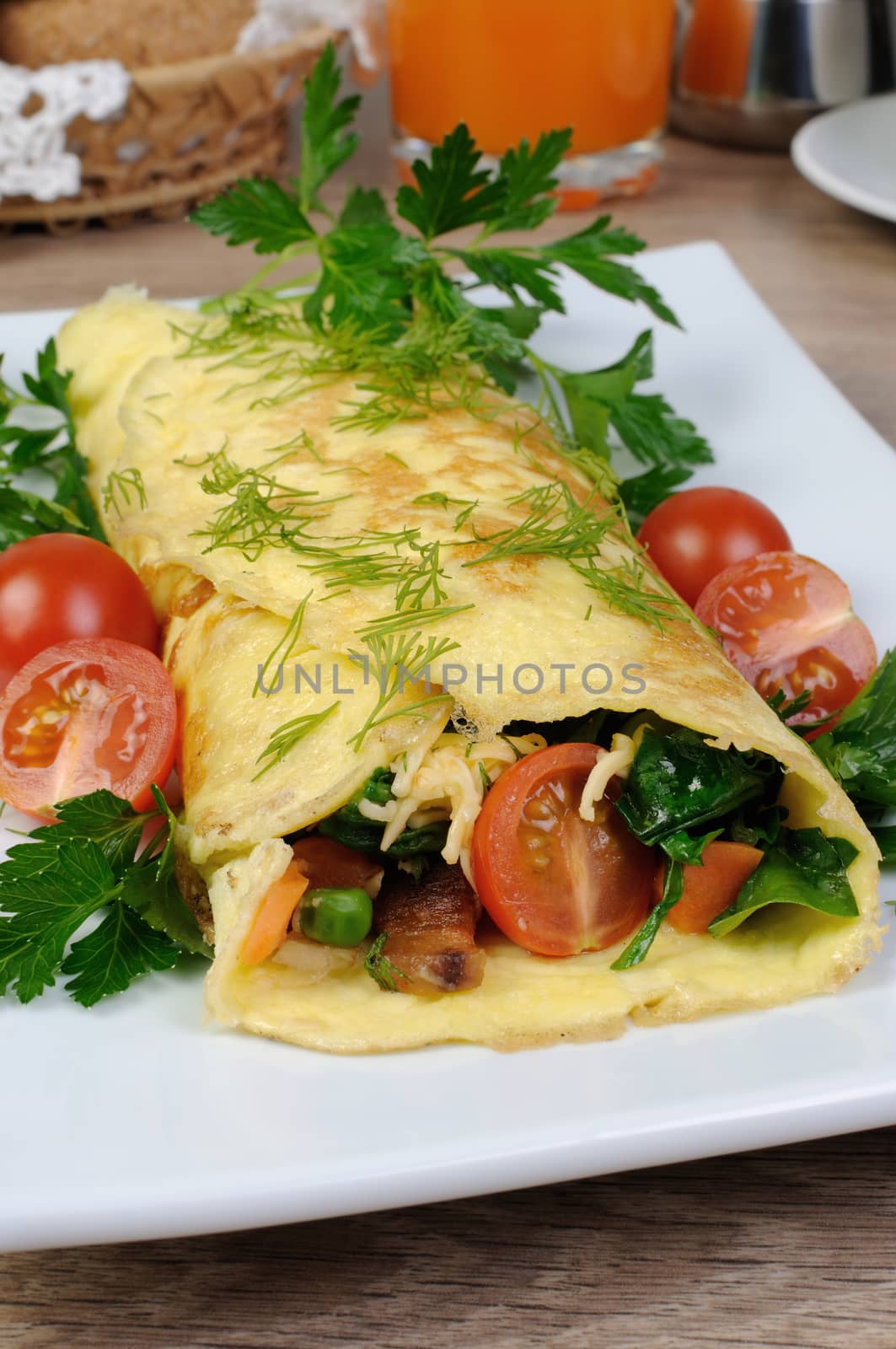 Omelet stuffed  vegetables with herbs and tomatoes