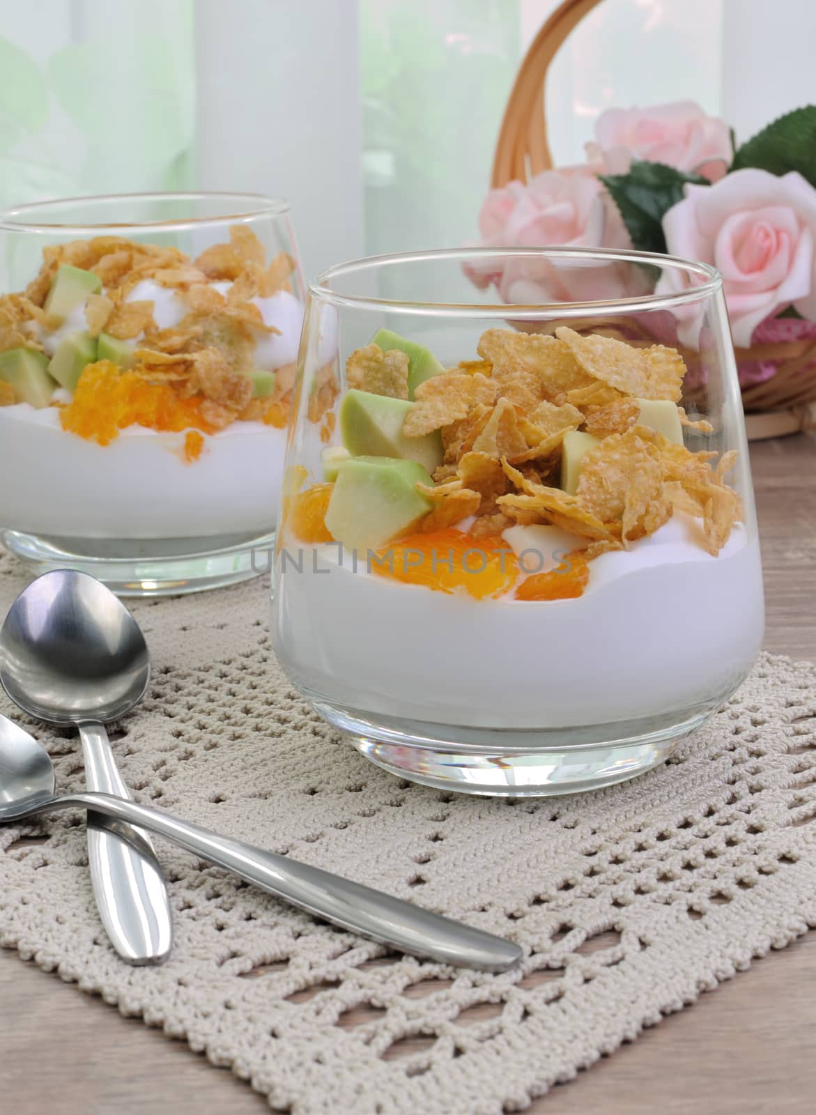 Parfait with slices of orange, avocado and flakes