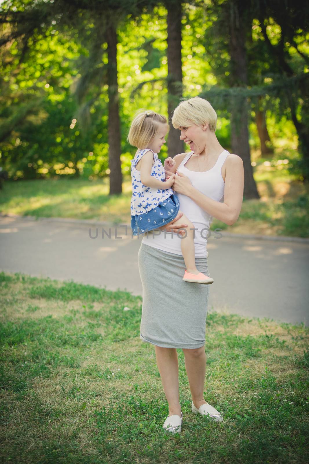 Mother with baby at outdoor by sarymsakov