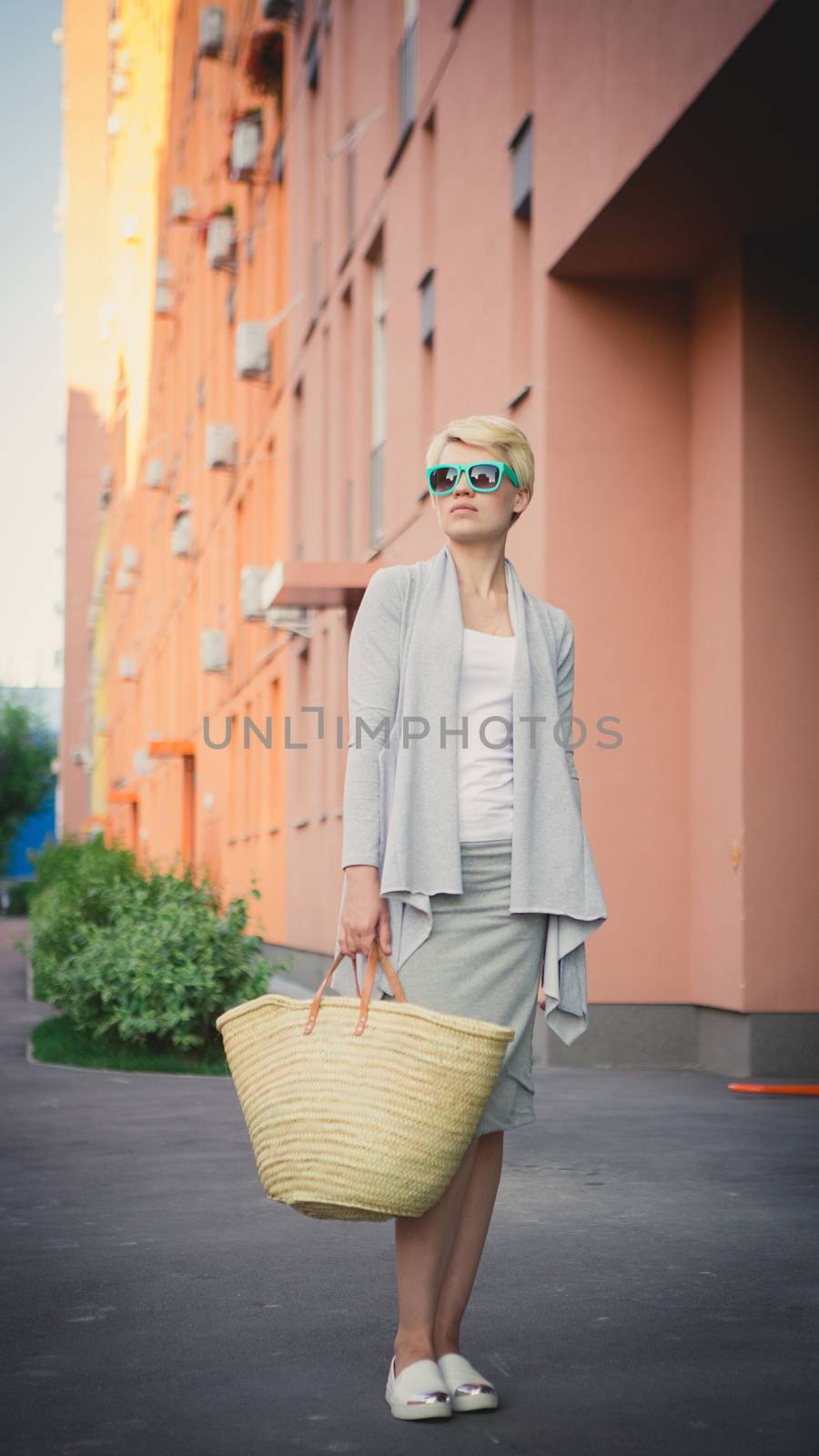 young beautiful woman posing outdoors. stylish fashion portrait